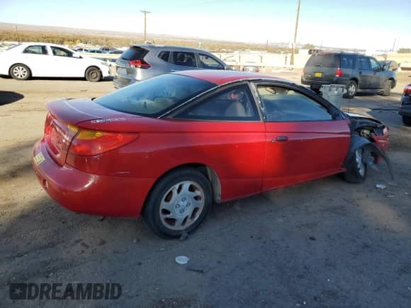 2002 Saturn SC with VIN 1G8ZN12892Z151672, listed as a Copart auction lot 80157144 with Not provided miles and Salvage title. Bid and sale history available at DreamBid. Image 3.