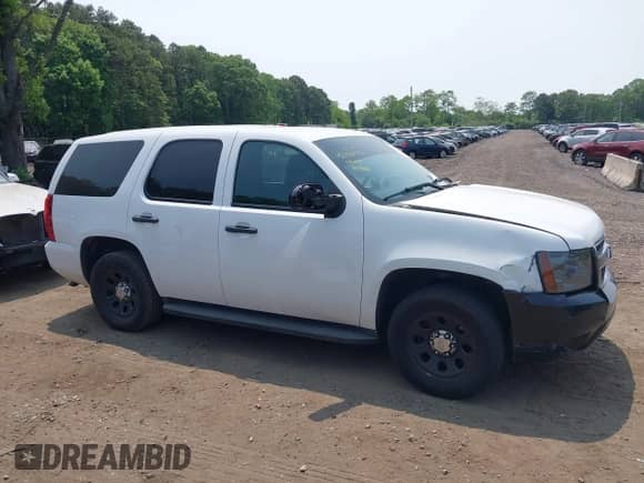 2014 Chevrolet Tahoe Commercial with VIN 1GNLC2E07ER228838, listed as a IAAI auction lot 42410417 with 140,342 mi miles and . Bid and sale history available at DreamBid. Image 13.