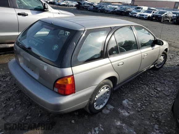 1997 Saturn SW with VIN 1G8ZK8276VZ397575, listed as a Copart auction lot 86637614 with 119,683 mi miles and Salvage title. Bid and sale history available at DreamBid. Image 3.