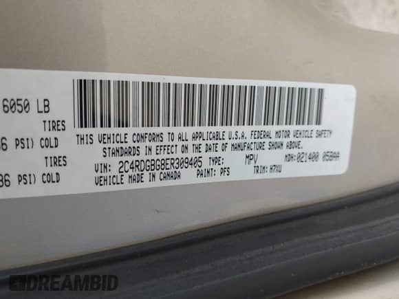 2014 Dodge Grand Caravan SE with VIN 2C4RDGBG8ER309405, listed as a IAAI auction lot 43276389 with 242,036 mi miles and . Bid and sale history available at DreamBid. Image 9.