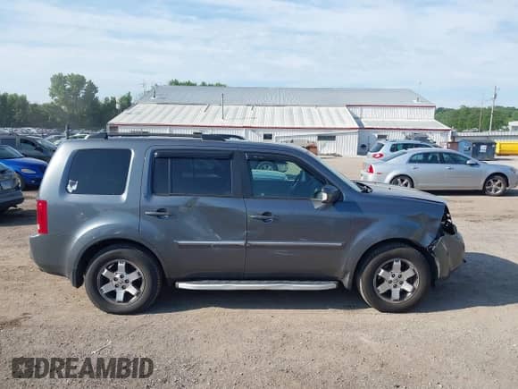 2010 Honda Pilot Touring with VIN 5FNYF4H88AB012001, listed as a IAAI auction lot 42635771 with 287,115 mi miles and . Bid and sale history available at DreamBid. Image 14.