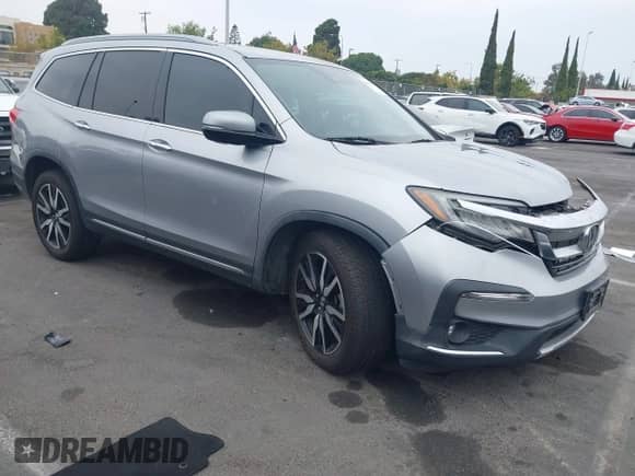 2019 Honda Pilot Elite z VIN 5FNYF6H02KB095402, wystawiony jako IAAI lot #42967099 z przebiegiem 100 310 mil mil oraz . Historia ofert i sprzedaży dostępna na DreamBid. Obrazek 1.