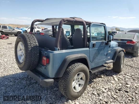 1998 Jeep Wrangler Sport z VIN 1J4FY19S5WP798597, wystawiony jako Copart lot #68707305 z przebiegiem Nie podano mil oraz Szkoda całkowita • Salvage title. Historia ofert i sprzedaży dostępna na DreamBid. Obrazek 3.