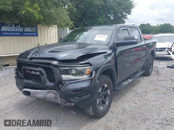 2020 Ram 1500 Rebel z VIN 1C6SRFLT0LN315399, wystawiony jako IAAI lot #42988101 z przebiegiem 93 786 mil mil oraz . Historia ofert i sprzedaży dostępna na DreamBid. Obrazek 17.