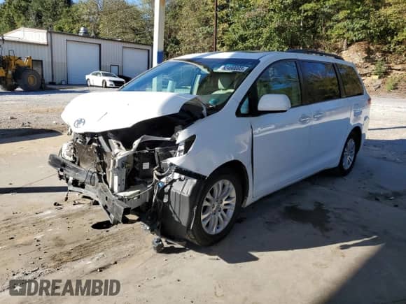 2011 Toyota Sienna XLE with VIN 5TDYK3DC1BS056810, listed as a Copart auction lot 82490085 with 202,063 mi miles and Salvage title. Bid and sale history available at DreamBid. Image 1.
