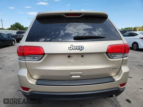 2014 Jeep Grand Cherokee Laredo with VIN 1C4RJEAGXEC185418, listed as a Copart auction lot 69435215 with 207,954 mi miles and Salvage title. Bid and sale history available at DreamBid. Image 6.