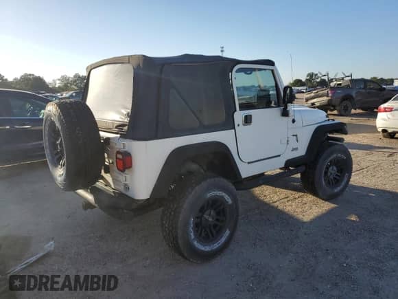 1999 Jeep Wrangler Sport with VIN 1J4FY19SXXP412760, listed as a Copart auction lot 84983895 with 180,172 mi miles and Clean title. Bid and sale history available at DreamBid. Image 3.