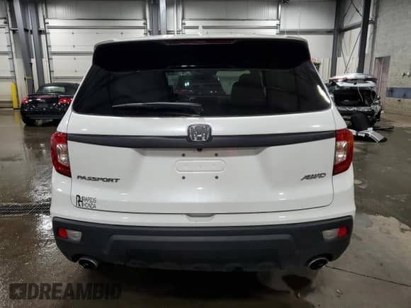 2020 Honda Passport EX-L with VIN 5FNYF8H59LB016607, listed as a Copart auction lot 69246785 with 84,042 mi miles and Salvage title. Bid and sale history available at DreamBid. Image 6.