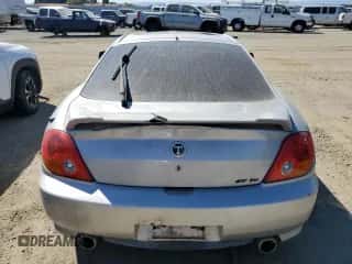 2003 Hyundai Tiburon GT с VIN KMHHN65F83U024950, выставлен на аукционе Copart как лот 70780994 с пробегом 178 681 миль миль и Списание • Salvage title. История ставок и продаж доступна на DreamBid. Изображение 6.