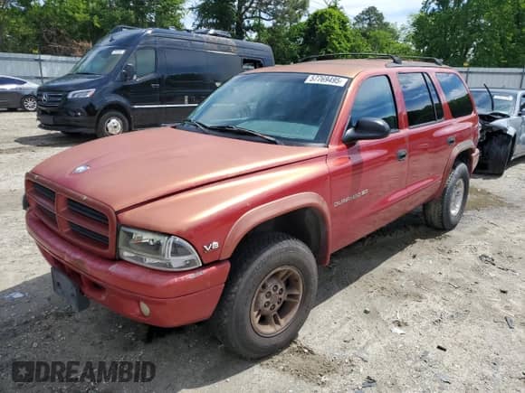 1998 Dodge Durango with VIN 1B4HS28Y0WF110147, listed as a Copart auction lot 57769495 with 316,913 mi miles and Salvage title. Bid and sale history available at DreamBid. Image 1.