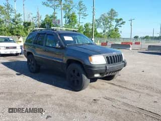 2002 Jeep Grand Cherokee with VIN 1J4GX38S32C238339, listed as a IAAI auction lot 42653341 with 264,189 mi miles and . Bid and sale history available at DreamBid. Image 1.