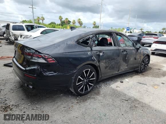 2023 Honda Accord Touring with VIN 1HGCY2F87PA028866, listed as a Copart auction lot 63202525 with 10,744 mi miles and Salvage title. Bid and sale history available at DreamBid. Image 3.