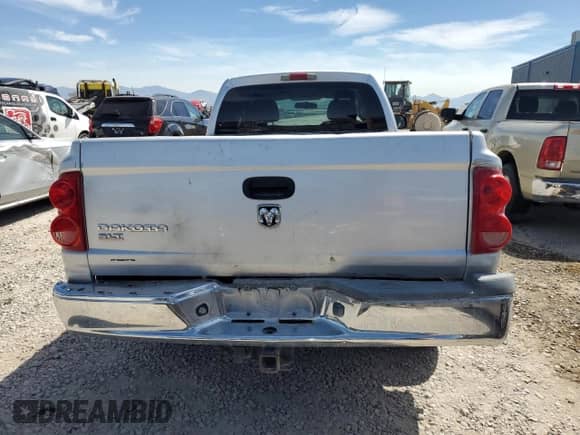 2005 Dodge Dakota SLT with VIN 1D7HE42K25S251047, listed as a Copart auction lot 66399585 with 53,708 mi miles and Salvage title. Bid and sale history available at DreamBid. Image 6.