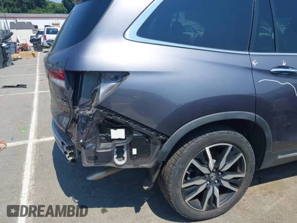 2020 Honda Pilot Touring 7-Passenger z VIN 5FNYF5H61LB011831, wystawiony jako IAAI lot #42681354 z przebiegiem 62 278 mil mil oraz . Historia ofert i sprzedaży dostępna na DreamBid. Obrazek 20.