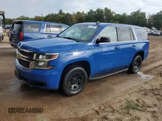 2017 Chevrolet Tahoe Commercial with VIN 1GNSKDEC0HR293815, listed as a Copart auction lot 82063135 with 127,983 mi miles and Clean title. Bid and sale history available at DreamBid. Image 1.