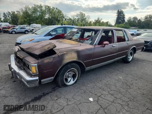 1984 Chevrolet Caprice z VIN 1G1AN69H0EH138172, wystawiony jako Copart lot #72030645 z przebiegiem Nie podano mil oraz Szkoda całkowita • Salvage title. Historia ofert i sprzedaży dostępna na DreamBid. Obrazek 1.