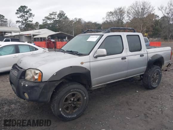 2001 Nissan Frontier SE with VIN 1N6ED27T91C318489, listed as a IAAI auction lot 41441798 with 214,834 mi miles and . Bid and sale history available at DreamBid. Image 6.