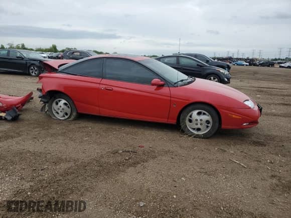 2002 Saturn SC with VIN 1G8ZY14732Z215717, listed as a Copart auction lot 57707765 with 85,232 mi miles and Salvage title. Bid and sale history available at DreamBid. Image 4.