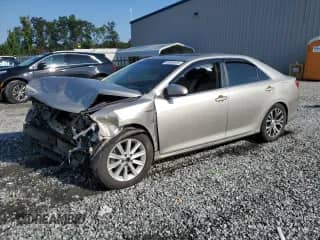 2014 Toyota Camry LE with VIN 4T1BD1FK8EU106252, listed as a Copart auction lot 68969405 with 256,940 mi miles and Salvage title. Bid and sale history available at DreamBid. Image 1.
