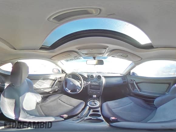 2006 Hyundai Tiburon GS с VIN KMHHM65D06U207409, выставлен на аукционе Copart как лот 80970414 с пробегом 173 396 миль миль и Списание • Salvage title. История ставок и продаж доступна на DreamBid. Изображение 13.