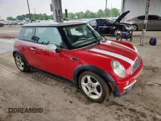 2004 MINI Hardtop with VIN WMWRC33474TJ59565, listed as a Copart auction lot 60507235 with 88,920 mi miles and Salvage title. Bid and sale history available at DreamBid. Image 4.
