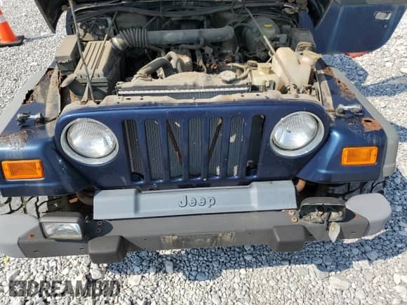 2000 Jeep Wrangler Sport with VIN 1J4FA49S5YP744967, listed as a Copart auction lot 67909665 with 141,990 mi miles and Clean title. Bid and sale history available at DreamBid. Image 12.