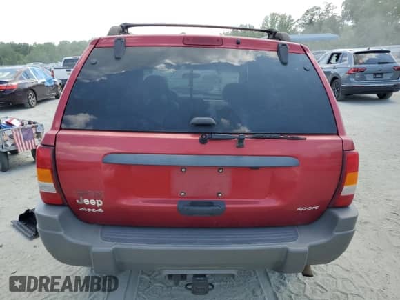 2002 Jeep Grand Cherokee Sport with VIN 1J4GW38S72C252344, listed as a Copart auction lot 61769485 with 306,152 mi miles and Salvage title. Bid and sale history available at DreamBid. Image 6.