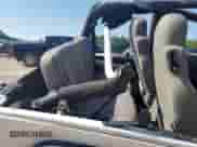 2005 Jeep Wrangler X z VIN 1J4FA39SX5P351763, wystawiony jako Copart lot #69419165 z przebiegiem 160 832 mil mil oraz Nie do naprawy • Non repairable. Historia ofert i sprzedaży dostępna na DreamBid. Obrazek 10.