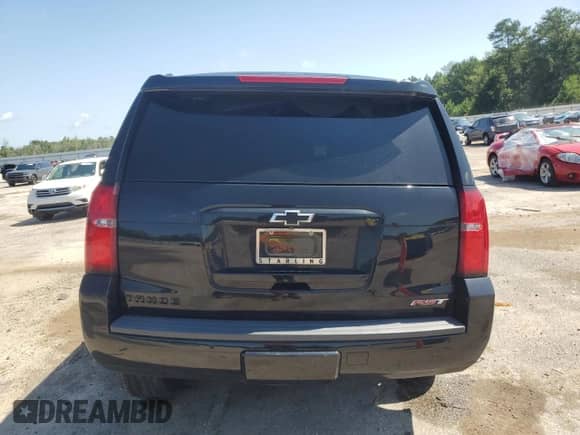 2019 Chevrolet Tahoe Premier with VIN 1GNSCCKJ3KR322922, listed as a Copart auction lot 61333165 with 106,380 mi miles and Salvage title. Bid and sale history available at DreamBid. Image 6.