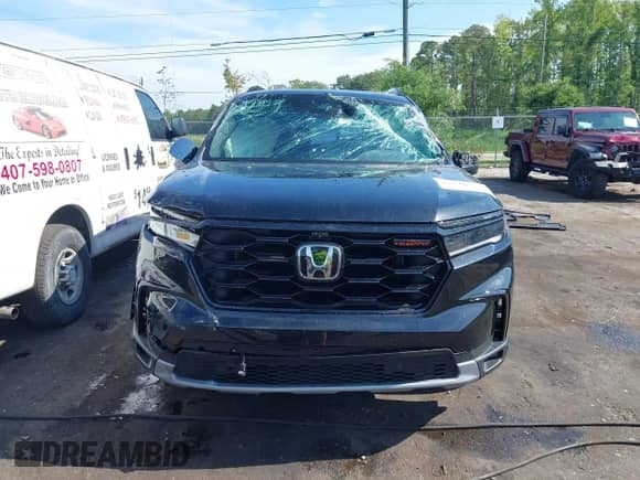 2023 Honda Pilot TrailSport with VIN 5FNYG1H67PB042092, listed as a IAAI auction lot 42376552 with 24,201 mi miles and . Bid and sale history available at DreamBid. Image 12.