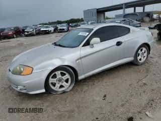 2003 Hyundai Tiburon GT with VIN KMHHN65F23U084299, listed as a Copart auction lot 75105394 with 90,598 mi miles and Clean title. Bid and sale history available at DreamBid. Image 1.
