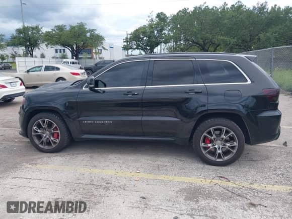 2012 Jeep Grand Cherokee SRT-8 z VIN 1C4RJFDJ5CC125878, wystawiony jako IAAI lot #42972918 z przebiegiem 109 967 mil mil oraz . Historia ofert i sprzedaży dostępna na DreamBid. Obrazek 14.