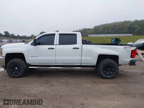 2015 Chevrolet Silverado 2500HD Work Truck with VIN 1GC1KUE89FF140896, listed as a IAAI auction lot 43308782 with 197,170 mi miles and . Bid and sale history available at DreamBid. Image 14.