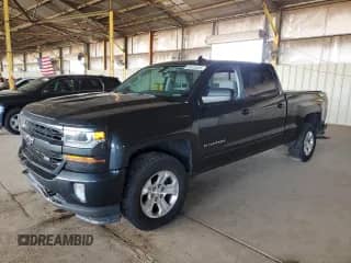 2018 Chevrolet Silverado 1500 LT with VIN 3GCUKREC9JG570580, listed as a Copart auction lot 69575445 with 106,245 mi miles and Salvage title. Bid and sale history available at DreamBid. Image 1.