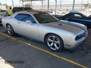 2012 Dodge Challenger R/T with VIN 2C3CDYBT6CH107999, listed as a IAAI auction lot 42837530 with 124,448 mi miles and . Bid and sale history available at DreamBid. Image 1.