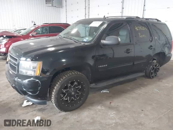 2014 Chevrolet Tahoe LT with VIN 1GNSCBE07ER249202, listed as a IAAI auction lot 42546283 with 124,538 mi miles and . Bid and sale history available at DreamBid. Image 18.