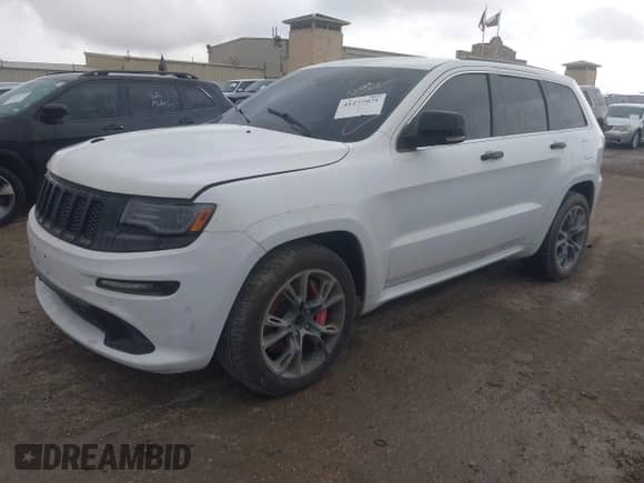 2015 Jeep Grand Cherokee SRT z VIN 1C4RJFDJ8FC951631, wystawiony jako IAAI lot #41277071 z przebiegiem 93 604 mil mil oraz . Historia ofert i sprzedaży dostępna na DreamBid. Obrazek 2.