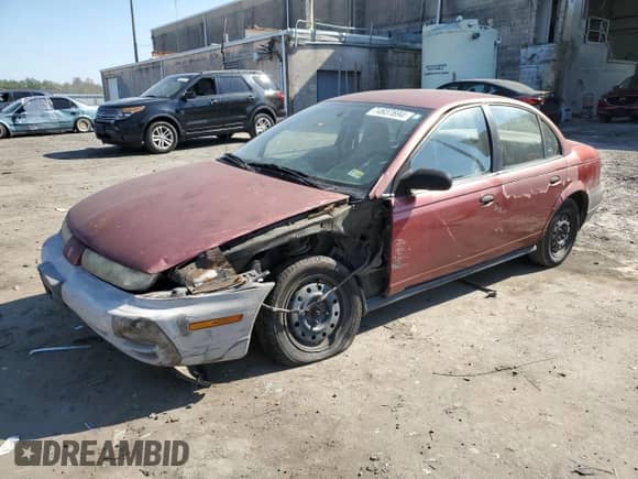 1997 Saturn SL with VIN 1G8ZF5285VZ412630, listed as a Copart auction lot 74937694 with 165,371 mi miles and Salvage title. Bid and sale history available at DreamBid. Image 1.
