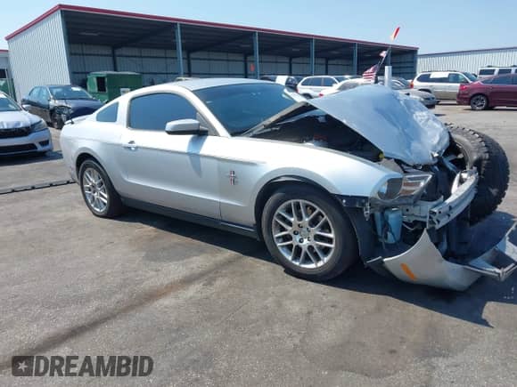 2012 Ford Mustang V6 with VIN 1ZVBP8AM7C5220275, listed as a IAAI auction lot 43152834 with 211,238 mi miles and . Bid and sale history available at DreamBid. Image 1.