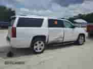 2016 Chevrolet Suburban LTZ with VIN 1GNSKJKCXGR207606, listed as a Copart auction lot 70943125 with 169,007 mi miles and Salvage title. Bid and sale history available at DreamBid. Image 3.