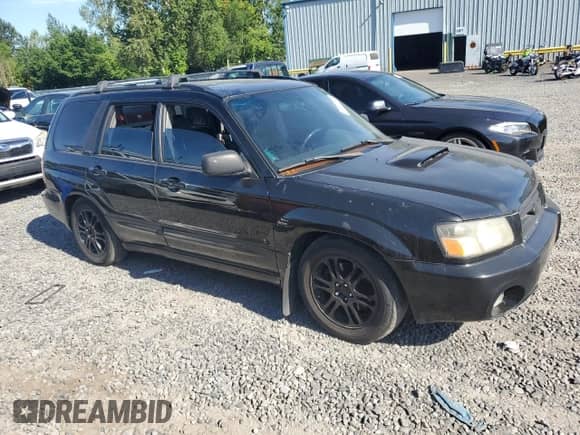 2004 Subaru Forester XT with VIN JF1SG69654H724553, listed as a Copart auction lot 63303605 with 238,806 mi miles and Salvage title. Bid and sale history available at DreamBid. Image 4.