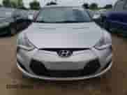 2013 Hyundai Veloster w/Gray Int z VIN KMHTC6AD5DU136899, wystawiony jako Copart lot #66874144 z przebiegiem 89 446 mil mil oraz Szkoda całkowita • Salvage title. Historia ofert i sprzedaży dostępna na DreamBid. Obrazek 5.