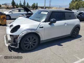 2014 MINI Hardtop with VIN WMWXM5C59ET935592, listed as a Copart auction lot 69481675 with 76,303 mi miles and Salvage title. Bid and sale history available at DreamBid. Image 1.