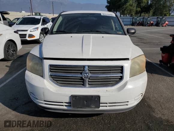 2010 Dodge Caliber SXT with VIN 1B3CB4HA3AD595658, listed as a Copart auction lot 85376495 with 209,626 mi miles and Salvage title. Bid and sale history available at DreamBid. Image 5.