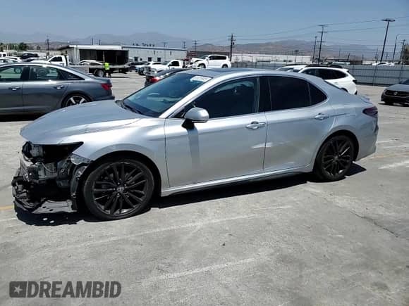 2022 Toyota Camry Hybrid XSE с VIN 4T1K31AK1NU036801, выставлен на аукционе Copart как лот 61826905 с пробегом 113 437 миль миль и Списание • Salvage title. История ставок и продаж доступна на DreamBid. Изображение 13.