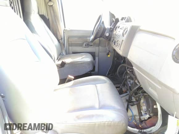 2012 Ford Econoline Cargo Recreational with VIN 1FTNE2EL2CDA20303, listed as a IAAI auction lot 36455077 with 208,612 mi miles and . Bid and sale history available at DreamBid. Image 5.