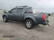 2011 Nissan Frontier Pro-4X with VIN 1N6AD0EV3BC448597, listed as a Copart auction lot 85487545 with 178,348 mi miles and Salvage title. Bid and sale history available at DreamBid. Image 2.