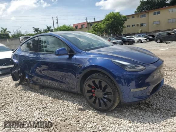2022 Tesla Model Y Performance with VIN 7SAYGDEF6NF455028, listed as a Copart auction lot 61740254 with 26,869 mi miles and Salvage title. Bid and sale history available at DreamBid. Image 4.