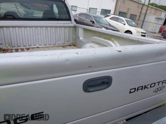 2004 Dodge Dakota with VIN 1D7HG12K44S628159, listed as a IAAI auction lot 42952012 with Not provided miles and . Bid and sale history available at DreamBid. Image 14.