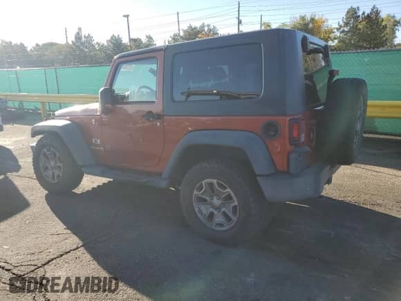2009 Jeep Wrangler X with VIN 1J4FA24149L707842, listed as a Copart auction lot 85186375 with 142,001 mi miles and Clean title. Bid and sale history available at DreamBid. Image 2.